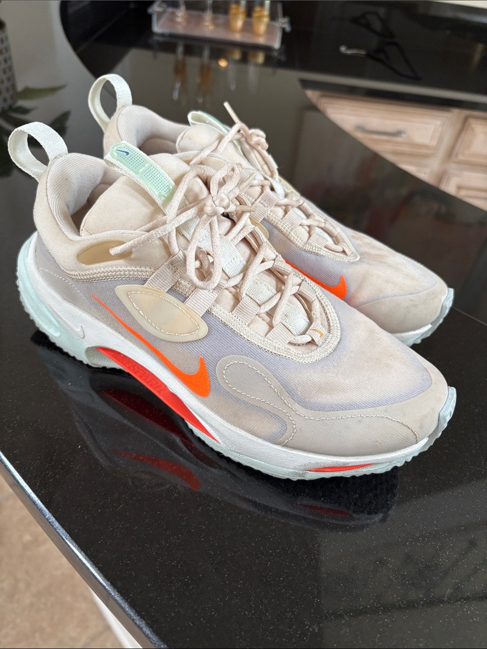 Nike Women’s Beige Sneakers with Bright Orange Swoosh